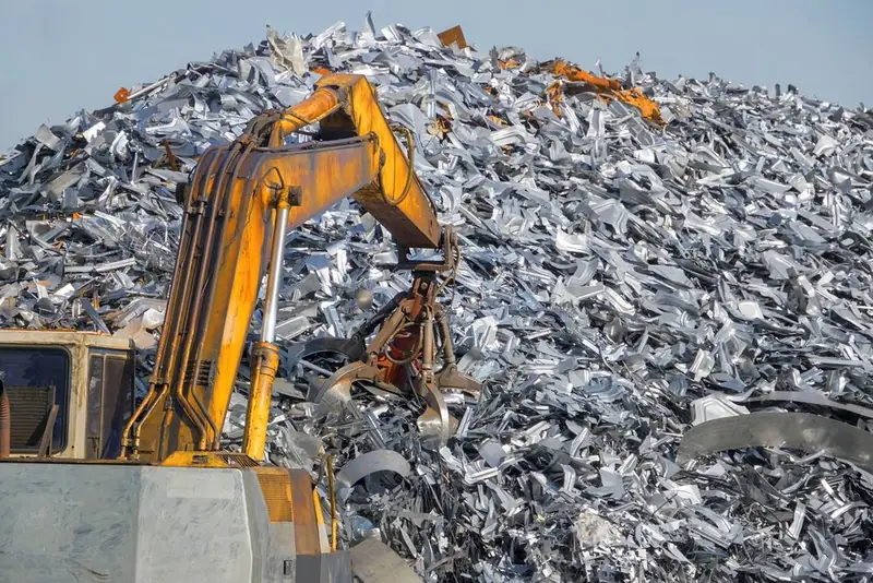 Excavator loading scrap in a yard